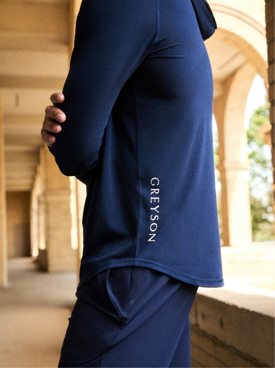 Navy Technical Hoodie Side Logo Detail - Greyson Wordmark On Model | Greyson Clothiers