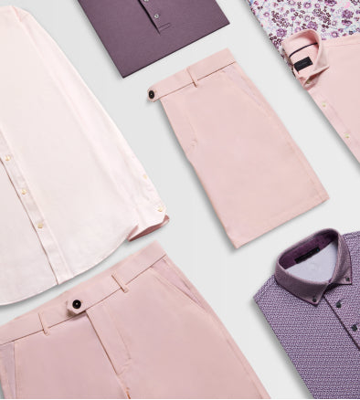 Collection of pink and purple clothing items on a light background
